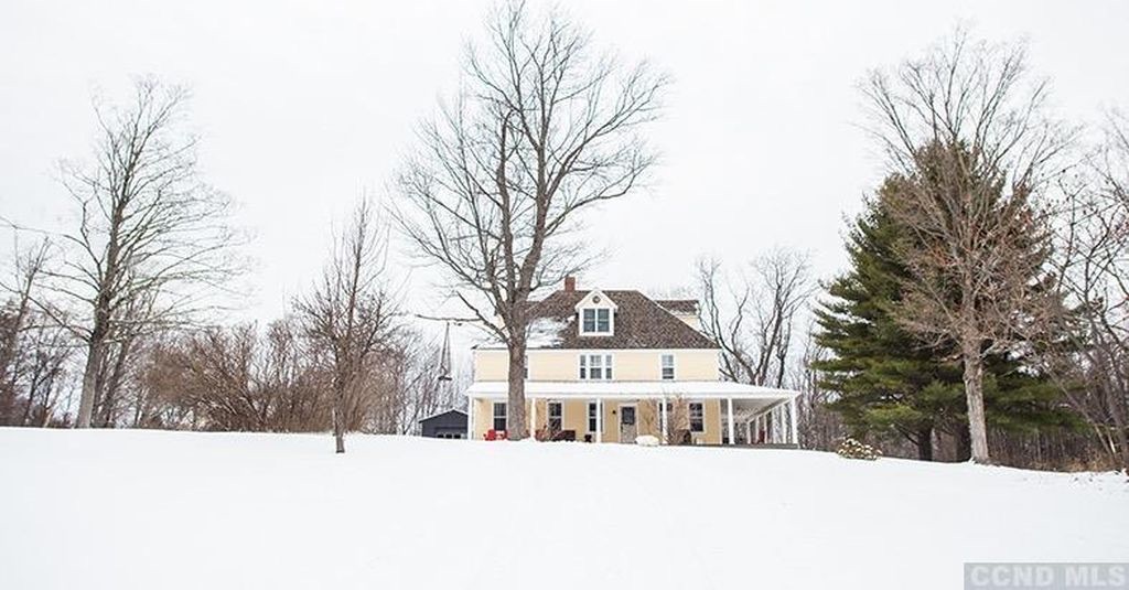 Elliot Place in winter — the full estate under snow