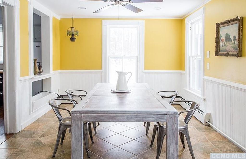 Breakfast room off the kitchen with natural light and casual dining furniture