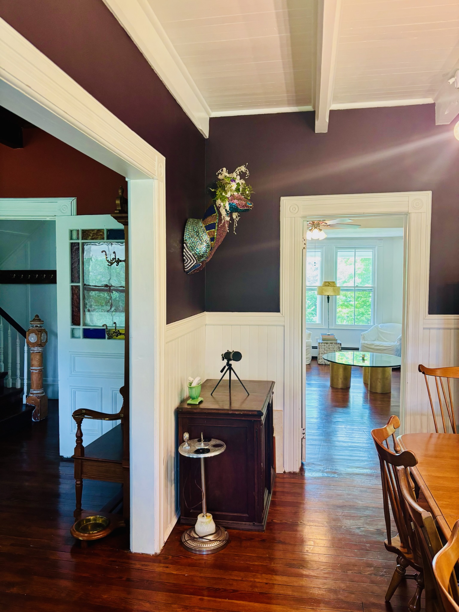 Dining room farm table set with Windsor chairs and candlesticks