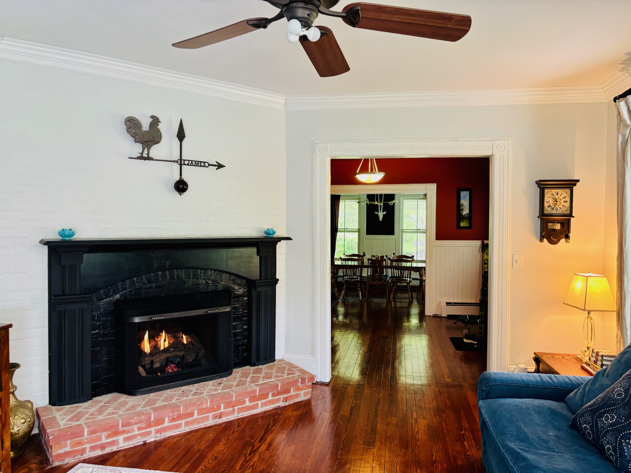 Fireplace living room seating area with period furniture and original architectural details