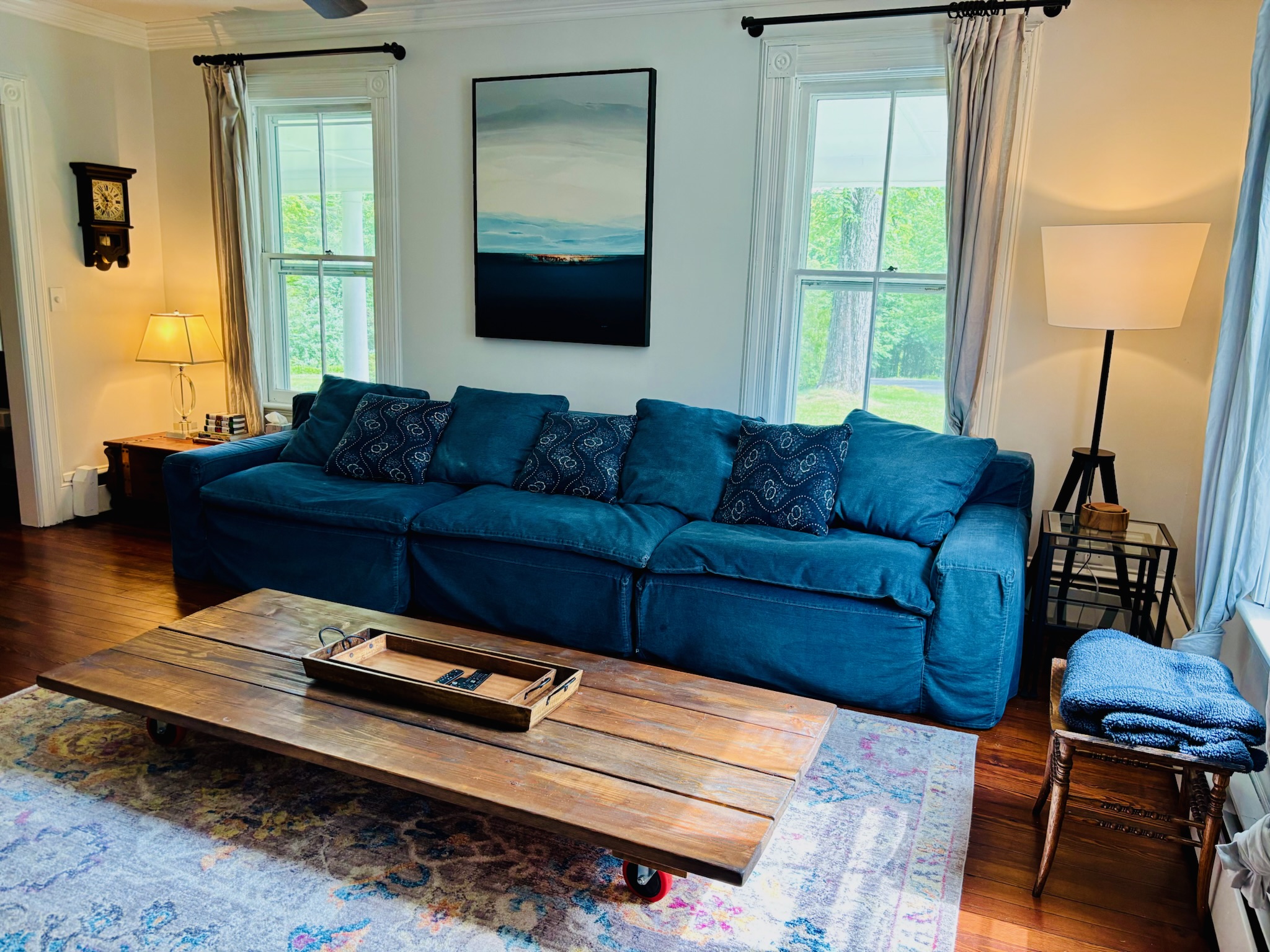 Fireplace living room showing full space with warm lighting and period millwork
