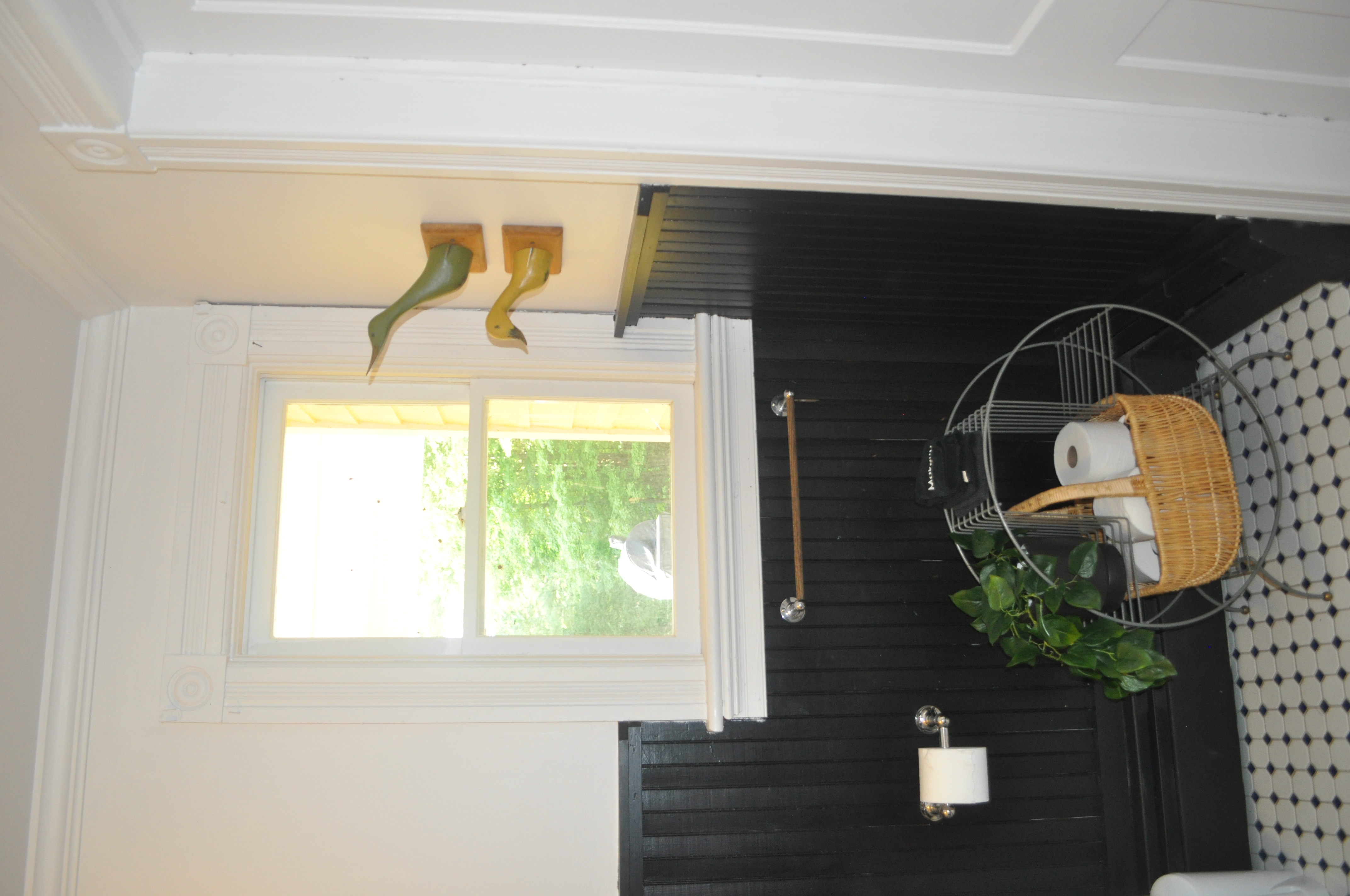 First floor bathroom tub-shower combination with white subway tile surround