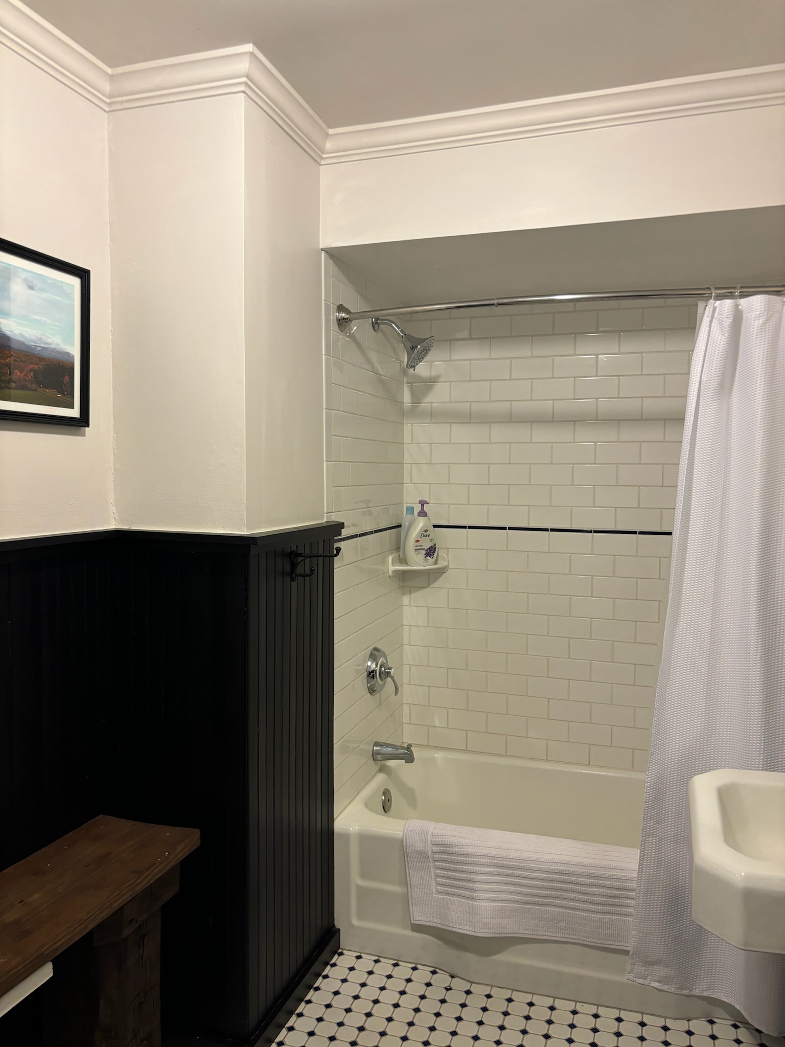 First floor bathroom from doorway showing original millwork door frame