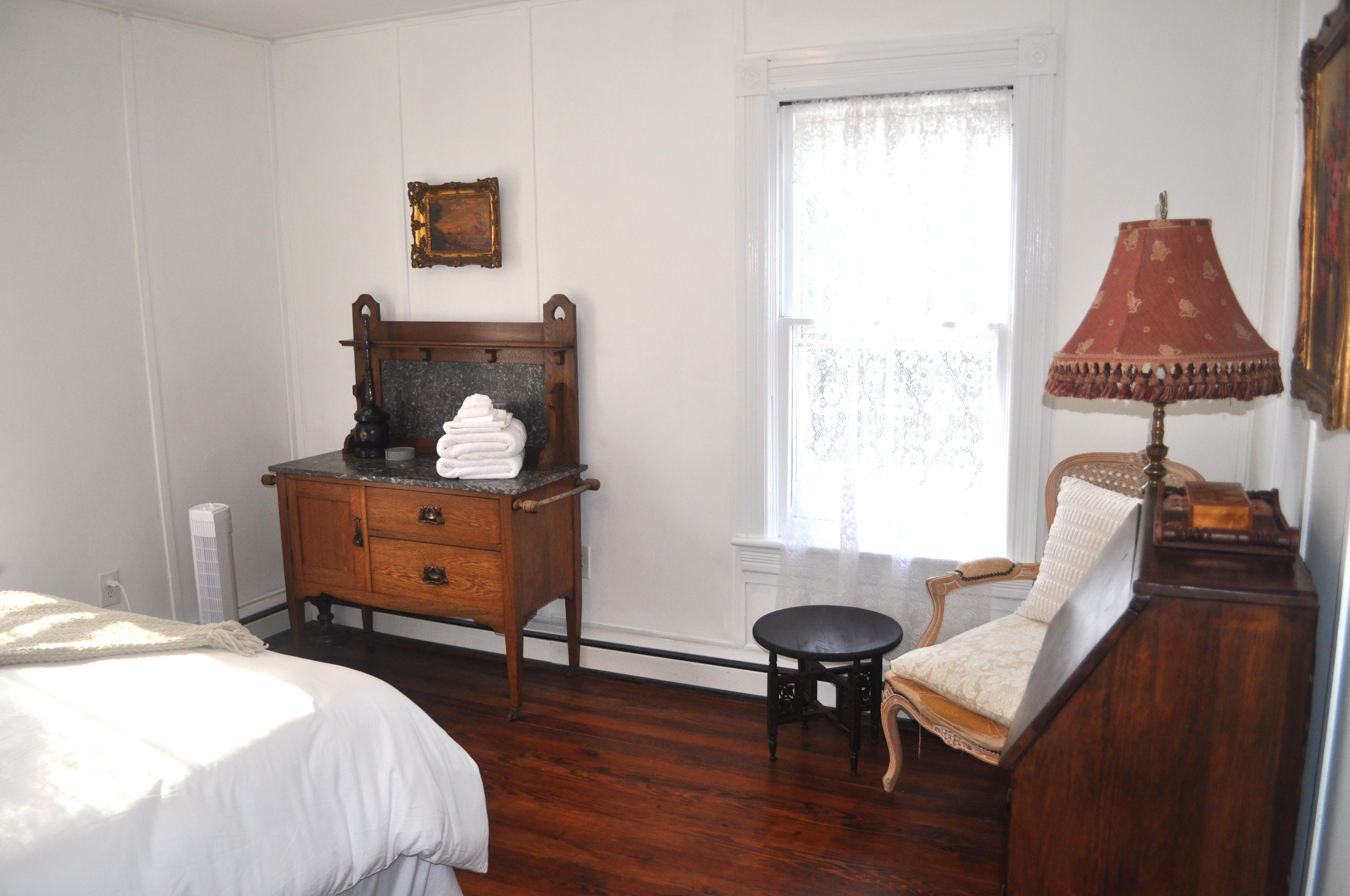 Bedroom four detail showing original millwork and window surround