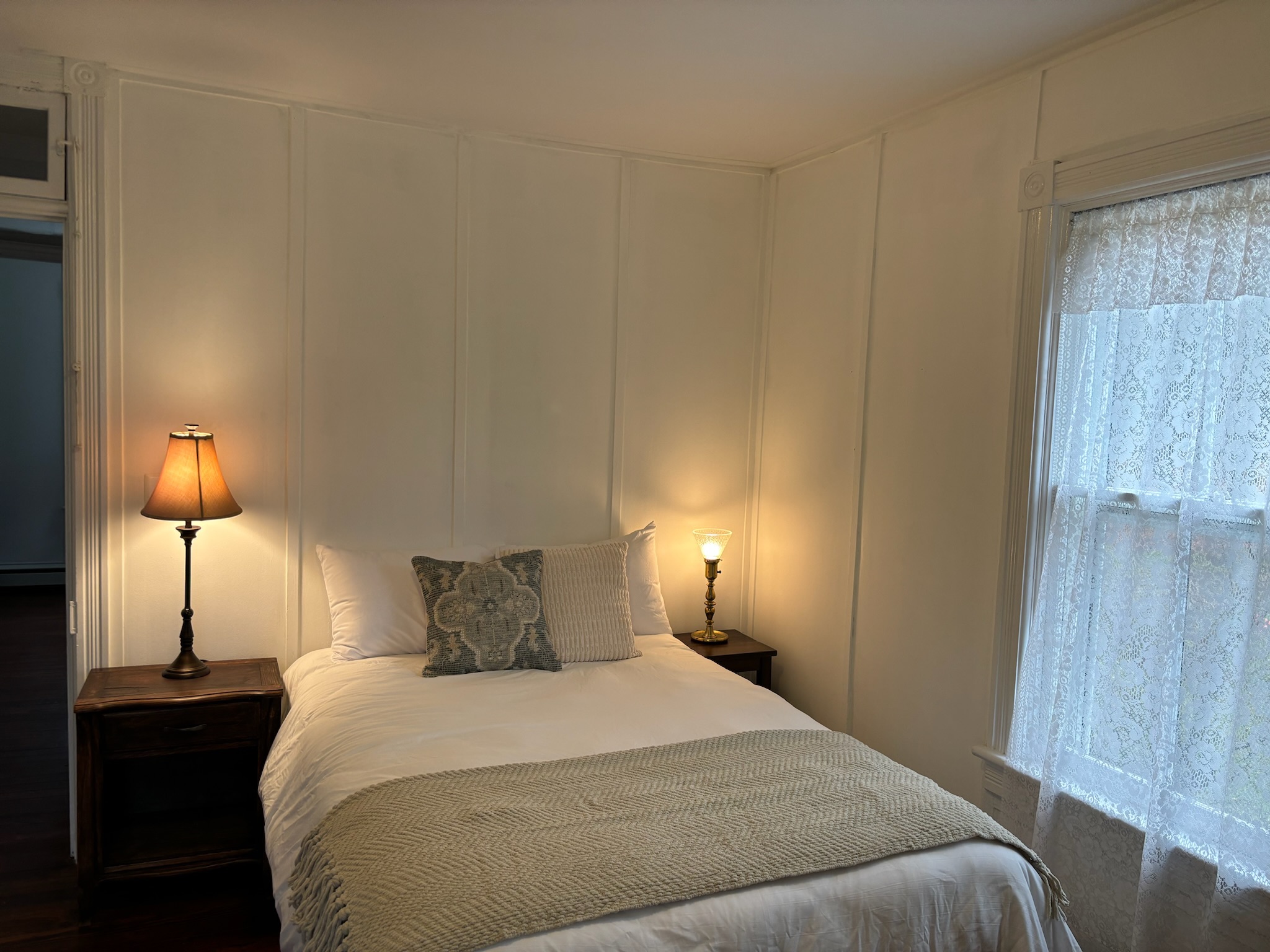 Bedroom four from alternate angle showing natural light and full room layout
