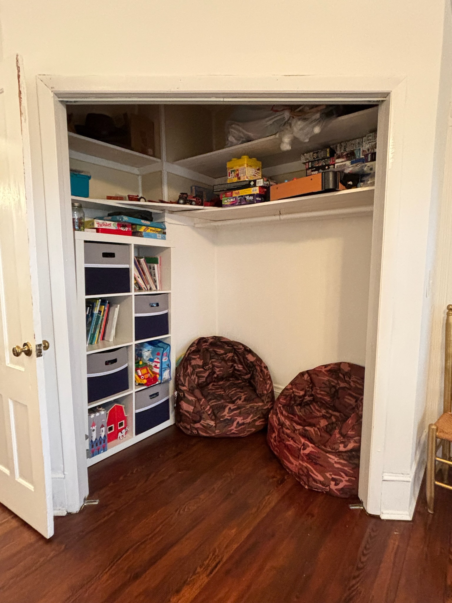 White living room upright piano in corner with original millwork window surround