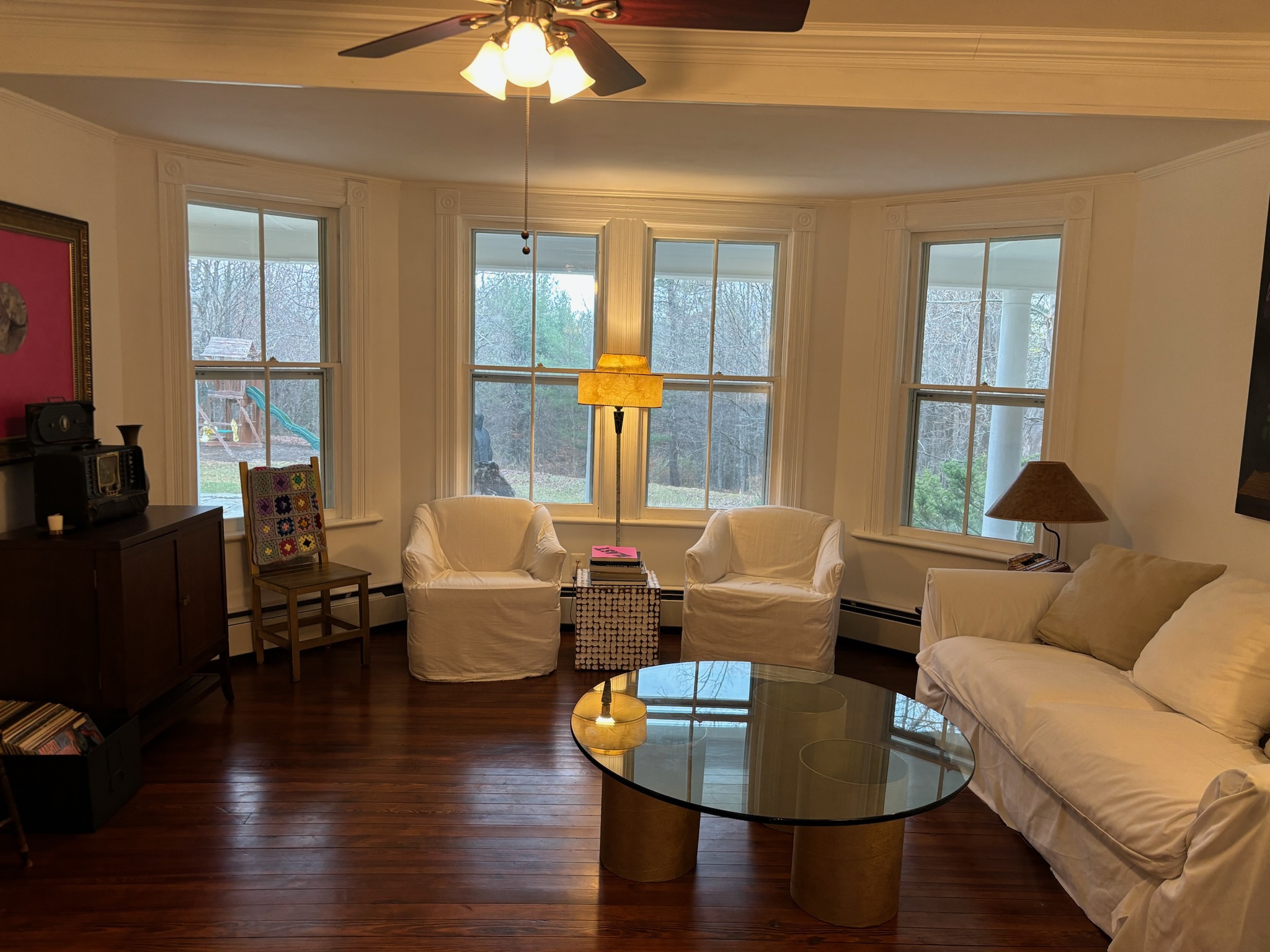 White living room seating with white sofas and armchairs